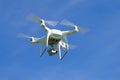 Flying quadrocopter `Phantom 4 Advanced` close-up against the blue sky Royalty Free Stock Photo