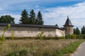 Izborsk Tower with fortress wall of Holy Dormition Pskovo-Pechersky Monastery. Pechory, Russia Royalty Free Stock Photo