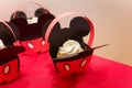 Candy bar. Cupcake in paper basket. Mickey Mouse party. Decorations with Walt Disney cartoon for children