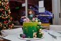 Izmail, Ukraine. January 2021. Beautiful green birthday cake with number 5, girl and Kikoriki or Smeshariki cartoon figures on top Royalty Free Stock Photo