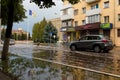 Izmail, Ukraine. 7 July 2020. Town streets flooded by heavy rain. Thunderstorm consequences. Cars floating in puddles. Climate Royalty Free Stock Photo