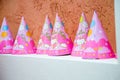 Hello kitty pink paper cones or hats.