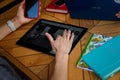 Izmail, Ukraine. May 2021. Colleagues having business lunch or coffee break. Female hands with tablet, smartphone, notebooks on