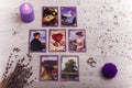 Divination cards alignment for love and family. Candle and wedding rings. Men and women relationships, astrology, fortune telling Royalty Free Stock Photo