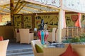 Thematic cafe exterior with Africa tribal pictures and statues