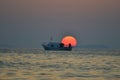 Izmir aliaga yenisakran bay fishermans in the boat and sun Royalty Free Stock Photo