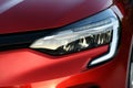 Close-Up: Red Renault Clio\'s Headlight