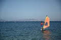 Izmir, Turkey - 28 August 2021: Windsurfer surfing the wind on waves In Yeni Foca.