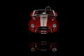 Front view of Shelby Cobra 427 Toy model car on a black background Royalty Free Stock Photo