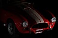 Front view of Shelby Cobra 427 Toy model car on a black background Royalty Free Stock Photo