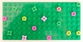 Izmir, Turkey - May 25 2023: Lego green baseplate with colorful Lego flowers on it