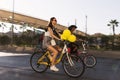 Woman riding a bicycle with baloons and fancy stuff in Izmir and on the day of Fancy Woman bike tour