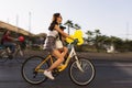 Woman riding a bicycle with baloons and fancy stuff in Izmir and on the day of Fancy Woman bike tour