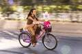 Young girl riding a bicycle with baloons and fancy stuff in Izmir and on the day of Fancy Woman bike tour