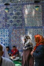 Iznik tile wall, veiled women