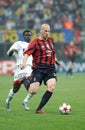 Jaap Stam and Obafemi Martins in action during the match