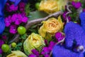 Flower composition with purple orchid flowers and soft yellow roses Royalty Free Stock Photo