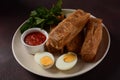 Jachnun or Jahnun, Yemenite Jewish pastry, served with fresh grated tomato and boiled egg and Zhug, Royalty Free Stock Photo