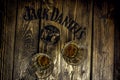 Jack Daniel`s sign on a rustic wooden pallet table with whiskey glasses Royalty Free Stock Photo