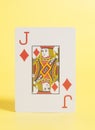 Jack of hearts playing card on a yellow Royalty Free Stock Photo