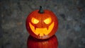 Jack-o-lantern pumpkin candle light, gray background