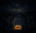 Jack O Lantern pumpkin with old ancient window castle over dead Royalty Free Stock Photo