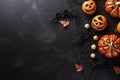 Jack O Lantern pumpkins and decorations on black background