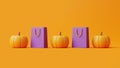 Jack-o-Lantern pumpkins and shopping bags on orange background Royalty Free Stock Photo