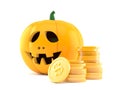 Jack o`lantern with stack of coins