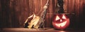 Jack o lanterns  Halloween pumpkin face on wooden background Royalty Free Stock Photo
