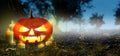 Jack O Lanterns pumpkin Glowing with candles In The Spooky Night forest - Banner. Halloween Scene background. Copyspace for text