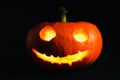 Jack-o-lanterns, pumpkin lantern, with a evil face on the black background Royalty Free Stock Photo