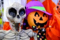 Jack O Lanterns pumpkin and skeleton dolls with smiling face. Happy halloween. Orange colors. - holidays, decoration and party