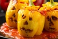 Jack o lanterns stuffed yellow pepper for Halloween. Royalty Free Stock Photo