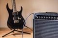 Plugged guitar and amp Royalty Free Stock Photo