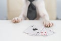 Jack russell terrier dog with glasses and tie plays poker. Addiction to gambling card games. Royalty Free Stock Photo