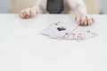 Jack russell terrier dog with glasses and tie plays poker. Addiction to gambling card games. Royalty Free Stock Photo