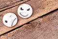 Jack Skellington cookies on wooden background.