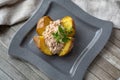 Jacket Potato , Baked Potato With Tuna Mayonnaise On Grey Square Plate On Wooden Background