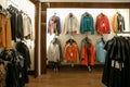 Jackets and coat hang on a hanger in a store. Royalty Free Stock Photo