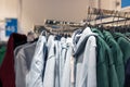 Jackets on hangers in a shop window Royalty Free Stock Photo