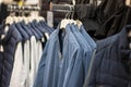 Jackets on hangers in a shop window Royalty Free Stock Photo