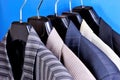 Jackets from suit men`s choice on the hanger in the store. Jacket in the wardrobe of a man is a decoration, accessory, business