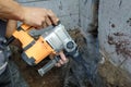 Jackhammer in action, pneumatic construction tool, drilling a hole in the concrete wall Royalty Free Stock Photo
