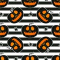 Jackolantern seamless pattern on striped background. Vector Halloween pumpkin with face illustration