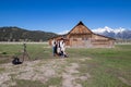 Jackson Hole, Wyoming, USA, May, 29, 20021: Tourist taking a family portrait next to the T.A. Moultan Barn in the Grand Teton Royalty Free Stock Photo