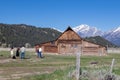 Jackson Hole, Wyoming, USA, May, 29, 20021: Tourist taking a family portrait next to the T.A. Moultan Barn in the Grand Teton Royalty Free Stock Photo