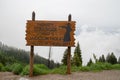 Jackson, Wyoming - June 25, 2020: Welcome sign for Jackson Hole area, Howdy Strangers - foggy, overcast day on Teton Pass