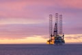 Jackup moveable oil platform at sunset in Gulf of Mexico Royalty Free Stock Photo