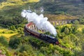 Jacobite steam train on Glenfinnan viaduct in Scotland, United Kingdom Royalty Free Stock Photo